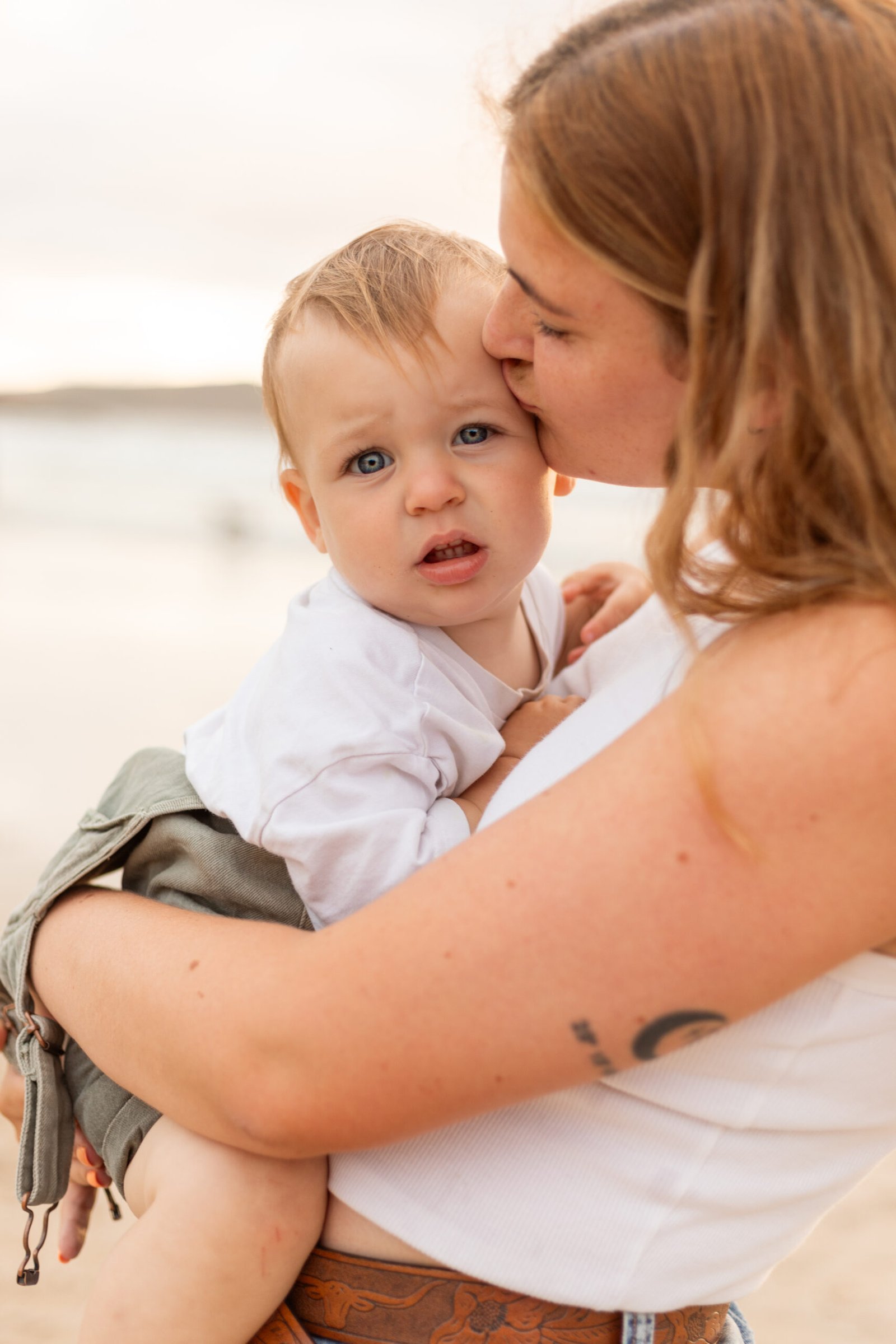 Natural light family photography with a mum cuddling her son